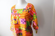 "amazing this print is stunning vintage 1970s cotton apron / dress/ top good vintage condition free size/ best for medium to large please check measurements: 20\" chest laying flat pit to pit 33\"long LOVE Thank YOU and please feel free to ask me any ?s:) Have a lovely day!! xoxo www.etsy.com/shop/retroandme" 1970s Cotton Tops With Retro Print, 1970s Retro Print Cotton Top, Retro Summer Blouse With Colorful Pattern, Retro Colorful Pattern Blouse For Summer, Retro Blouse With Colorful Pattern For Summer, Retro Colorful Summer Blouse, Spring Cotton Blouse With Retro Print, Retro Spring Cotton Blouse, Retro Cotton Blouse For Spring