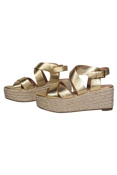 Transform into a golden goddess with these Joie wedges! Made with a gold strappy design and chic woven wedge, let these beauties become your go-to summer shoes! Perfect for your next island getaway. Pair with a maxi dress and straw bag for dinner and drinks at the tiki bar. Size 9 (EU 39) Leather upper w/ strappy design Ankle strap closure Open toe Woven platform wedge Leather sole and footbed w/ almost no wear Wedge 3" Platform 1.75" Gold Open Toe Wedge Sandals For Beach, Gold Open Toe Wedge Sandals For Summer, Gold Synthetic Wedge Sandals With Platform, Gold Platform Sandals For Vacation, Vacation Gold Platform Sandals, Summer Gold Synthetic Heels, Gold Synthetic Heels For Summer, Gold Round Toe Wedge Sandals For Vacation, Gold Synthetic Wedge Heel Sandals