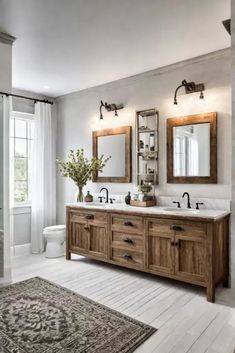 a bathroom with two sinks, mirrors and rugs on the floor in front of it