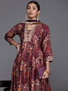 Grab this beautiful 2-piece set. The set comes with floral print & gota patti detailing anarkali kurta has v neck, 3/4th sleeves & calf length teamed with silk chiffon dupatta with lace detailing. Color - Mauve Kurta Fabric-Silk Dupatta Fabric - Silk Chiffon Neck-V Neck Sleeves-3/4th Sleeves Work - Floral Print & Gota Detailing Washing Instructions-Hand Wash DISCLAIMER - The color of the product may be differ due to screen settings of device. A misprint here and a color drop slip there is the beauty of printing which is not treated as a defect. Festive Designer Floral Print Kurta, Bollywood Style Floral Print Sharara For Eid, Bollywood Floral Sharara For Eid, Eid Sets With Sheer Dupatta, Anarkali Palazzo Set With V-neck And Dupatta, Festive Multicolor Anarkali Set With Printed Motifs, Bollywood Designer Floral Print Sets, Bollywood Style Floral Print Sharara For Festive Occasions, V-neck Kurta With Dupatta For Diwali