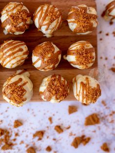 there are many desserts that are on the wooden board and ready to be eaten