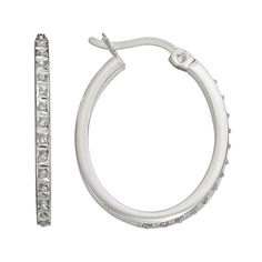 You're sure to shine every time you wear these Diamond Mystique oval hoop earrings. Comes in a gift box.Earring Details: Length: .75 in. Backings: click-it Metal: platinum over sterling silver Model no. SDF21617W Diamond Details: Total weight: less than 1/10 ct. Cut: round Image(s) may be enlarged to show detail. Diamond weights are approximate. Diamond total weights may vary between .01 and .08 ct. Some diamonds have fewer than 17 facets.Gemstones may have been treated to enhance their appearan Oval Hoop Earrings, Diamond Hoop Earrings, Jewelry Earrings Hoops, Silver Diamonds, Silver Bracelet, Platinum, Gift Box, Fine Jewelry, Hoop Earrings