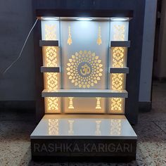 an illuminated display case in the shape of a buddha's head