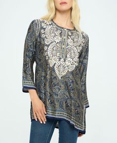 Featuring opulent patterns in rich colors, the Midnight Desert tunic showcases traditional Indian handicrafts with embroidered florals at the neck and hem. Topped with a buttoned henley neckline and side slits, it's made from a lux poly-silk blend. Embroidered Indian-style tunic Made from a polyester and silk blend 72% – Polyestere, 28% – Silk Henley neckline, vented hem Shades of midnight blue with sand-colored embroidery Made in India Garment Flat Measurement (Inches): Please note that the mea Bollywood Style Festival Kurta With Embroidered Neckline, Bollywood Style Embroidered Kurta For Festivals, Bohemian Eid Tunic With Printed Motifs, Bollywood Style Straight Kurta With Embroidered Neckline, Bohemian Blouse With Printed Motifs For Eid, Bohemian Tunic With Printed Motifs For Festive Occasions, Festive Eid Top With Embroidered Neckline, Bollywood Style V-neck Kurta With Embroidered Neckline, Traditional Straight Kurta With Embroidered Neckline