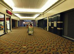 an empty shopping mall with the doors open