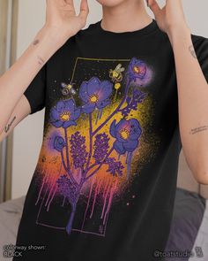 "This floral dripping cosmos t-shirt is great for plant, flower, and garden lovers. Great gift for anyone who spends their time enjoying nurseries, plant shopping, and botanical gardens. FABRIC CONTENT:  - Fabric content varies based on color. Solid colors are 100% cotton, heather colors are 52% cotton/48% polyester, Athletic Heather and Black Heather are 90% cotton/10% polyester) - Light fabric (4.2 oz/yd² (142 g/m   FIT & CONSTRUCTION :  - Runs true to size (sizing runs slightly larger for women, as this is a unisex style) - Side seams help hold the garment's shape longer and give structural support - Highly elastic ribbed knit collar and neck seam helps retain neck shape  - Reinforced shoulder and neck seams stabilize the back of garment and prevents stretching   SIZING : Please see siz Spring Graphic Tee With Graffiti Print, Spring Graffiti Print Short Sleeve T-shirt, Spring Short Sleeve T-shirt With Graffiti Print, Spring Crew Neck T-shirt With Paint Splatter, Graphic Tee With Paint Splatter, Spring Cotton T-shirt With Paint Splatter, Spring Grunge T-shirt With Sublimation Print, Grunge T-shirt With Sublimation Print For Spring, Artistic Screen Print T-shirt For Spring