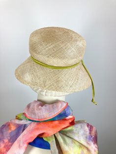 Meet "Pearl," a women's lightweight natural Open Weave Straw Summer Medium Brim Hat that is just the ticket for Ladies Tea, Church, or for everyday wear. The straw is an airy open weave in a natural straw and has tiny knots as part of the design. The brim is shorter in the back and wider at the front and sides. It is completely hand blocked over vintage wooden hat blocks and then hand sewn. It has a low and shallow domed crown (top). It is simply adorned with a narrow apple green band. An inner Fitted Sinamay Straw Hat With Curved Brim, Woven Short Brim Boater Hat, Natural Woven Fedora, Chic Toquilla Straw Hat, Natural Fedora With Short Brim For Spring, Natural Woven Short Brim Cloche Hat, Green Fedora With Curved Brim For Spring, Natural Woven Brimmed Cloche Hat, Natural Color Fedora With Short Brim For Spring