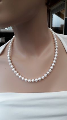 "Bridal pearl necklace, Natural white freshwater pearls, round white high luster pearls, genuine pearl necklace, Bridal gift, Gift for her, Handmade. Very nice, shining 8 mm pearls. The surface of these pearls is not 100% smooth (please see photos). AA+ quality. All metal parts - sterling silver 925. Toggl clasp. Total length - 20.08\" / 51 cm.  It is recommended to avoid contact with water/lotion/perfume. Important: Colors may look little different depending on your monitor settings. This necklace comes gift wrapped so it will be ready for gift. READY TO SHIP. Please notice: Combined postage is always available on multiple orders. Order more than one item, and pay only one postage." Classic White Pearl Necklace With Pearl Drop, Classic White Pearl Drop Necklace, White Pearl Necklace As A Gift, Pearl White Round Bridal Necklace With Pearl Chain, Pearl White Bridal Necklace With Pearl Chain, Pearl White Single Strand Pearl Necklace, White Pearl Drop Necklace Gift, White Pearl Drop Necklace As Gift, White Pearl Drop Necklace For Gift