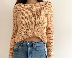 "Hand knit cotton sweater Color on the photo : PEACH Size on the photo: S ✔️55 % cotton  ✔️45 % acrylic  READY TO SHIP Measurements are various for every size because sweater is loose but anyway the top look oversized.  See size chart in the photo Dimensions for S size: Length - 44 cm. / 14.9\" Width - 50-55 cm. / 19.6\"-21.6\" Sleeve length - 62-65cm. /24.4\"-25.5\" Sleeve girth  - 28 cm. / 11\" Weight - 0.19 kg. /6.7oz  Model measurements: Height - 1.7 cm./ 5.7 ft. Bust - 87 cm./ 43'' Waist - 63 cm./ 24'' Hips - 90 cm./ 35.4\" OTHER COLORS: www.etsy.com/listing/662063364 This is a peach cotton short small loose sweater  Full hand knit summer sweater is super light. This is a fishnet style makes your outfit looks so hot. This sweater is light and transparent  Simple natural arm knit women Fall Cropped Sweater In Chunky Knit Cotton, Trendy Chunky Knit Cotton Sweater, Trendy Cotton Chunky Knit Sweater, Chunky Knit Cotton Sweater For Layering, Cotton Chunky Knit Sweater For Layering, Long Sleeve Cropped Cotton Sweater With Chunky Knit, Cotton Cropped Sweater With Chunky Knit, Cotton Cropped Sweater With Chunky Knit And Long Sleeves, Cropped Cotton Sweater With Chunky Knit And Long Sleeves