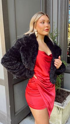 Put the glam in your Christmas look with a cozy and comfy faux fur jacket! Perfect for holiday parties and Christmas dinner, this jacket will make you a vision of holiday cheer! You'll be turning heads all season long! Comes in two colors - black and grey! 100% Polyester Model is wearing a size Small. Dress With Fur Coat, Faux Fur Jacket Outfit, Satin Dress Outfit, Fur Jacket Outfit, Black Fur Jacket, Fur Coat Outfit, Slip Mini Dress, Trendy Christmas Outfits, Red Fur