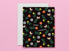 a black card with colorful cactus and flowers on it