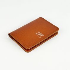 Our minimal leather card holders are handmade in our London workshop by our small team. They are designed to get better with age and wear. This slim wallet is made from our beautiful Italian coloured leather, the design is elegant, timeless and a practical accessories for everyday use. - Made from Italian Leather - Three separate card pockets - Dimensions: 75mm x 100mm If you're buying as a gift for a loved one why not make it that bit extra special with our monogramming service... Simply choose the option above and let us know in the Notes section what you'd like. Have fun with it! If you'd like to read all about our personalisation service, please take a look at our blog post here .. https://www.villageleathers.com/blogs/behind-the-seams/our-personalisation-service This style is availabl Minimalist Leather Bifold Card Holder, Modern Handmade Brown Wallets, Modern Handmade Brown Wallet, Modern Handmade Brown Card Holder, Leather Card Holder For Gift, Leather Smooth Grain Card Holder For Gift, Minimalist Leather Trifold Wallet Gift, Minimalist Brown Wallets As Gift, Handmade Minimalist Brown Wallet