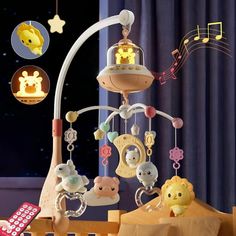 a baby crib with musical toys hanging from it