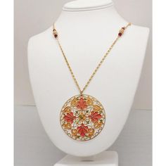 This is part of Chairish’s Costume Jewelry assortment.  1970s goldtone round orange and yellow plique-a-jour (stained glass) pendant  with faceted faux-garnet decoration on the chain necklace with spring ring clasp. Marked "Napier" on the jump ring that the clasp attaches to. Pendant measures: 2 3/16 inches across. Chain doubled measures: 14 3/4 inches long. Excellent condition. Gold Enamel Medallion Necklace, Gold Enamel Round Pendant Necklace, Red Enamel Round Necklace, Bohemian Gold Enamel Necklace, Gold Bohemian Enamel Necklace, Gold Enamel Bohemian Necklace, Red Medallion Necklace With Large Pendant, Red Enamel Jewelry With Large Pendant, Vintage Orange Metal Jewelry