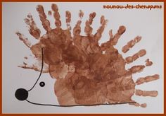 a hand print of a hedgehog on a white paper with an orange border around it