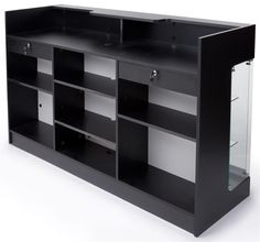 a black entertainment center with glass doors on the top and bottom shelves, in front of a white background