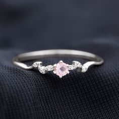 Product Details Add a touch of elegance to your life with this exquisite Leaf Promise Ring. It features a mesmerizing Round Shape Rose Quartz gemstone, delicately set in a 6-Prong Setting. Inspired by the natural beauty of a Leaf Branch, this ring showcases a stunning design that is both graceful and unique. The presence of scintillating round Diamond gems, intricately studded in a leaf design, enhances the beauty of this ring even further. Product Information SKU SHP-RINGS0821200137 Width 2.8 mm Height 3.7 mm Weight 1.26 gm (Approximate) ROSE QUARTZ INFORMATION No.of Stones 1 Pieces Total Weight 0.28 Carat (Approximate) Dimension(approx) Round-4X4 mm-1 Pcs Color Pink Cut Brilliant Shape Round Setting Type Prong-Setting Quality Grade AAA DIAMOND INFORMATION No.of Stones 6 Pieces Total Weig