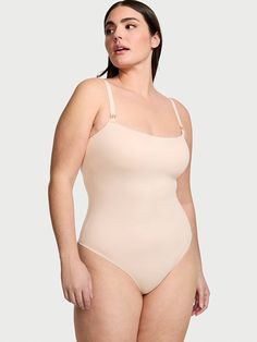 Destined to be your go-to base layer, this streamlined design is crafted in our baby-soft fabric that offers comfy, smoothing support. A straight neckline, high-cut leg, and hardware-embellished straps give definition to this wear-with-everything wardrobe staple. Lightly lined with built-in bra for added coverage and support Wireless Buttery smooth microfiber hugs your curves 4-way stretch moves with you Wicking material keeps you cool Adjustable camisole straps Flattering high-cut leg Gold V-ha Lingerie Catalog, Victoria Secret Outfits, Streamlined Design, Straight Neckline, Tops Online, Online Tops, Baby Soft, High Cut, Base Layer