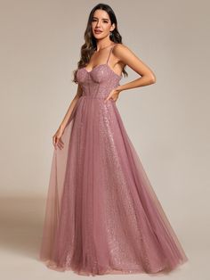 Be the embodiment of glamour and sophistication in our Spaghetti Straps Illusion Sleeveless A-Line Sequin Evening Dress with Tulle Cover. The alluring illusion neckline and delicate spaghetti straps frame your shoulders, while the A-line silhouette flatters your figure with its flowing and feminine shape. Adorned with shimmering sequins, this dress will make you the center of attention at any upscale event or red carpet affair. Pair with a chic updo and statement earrings for a truly show-stopping look. Chic Updo, Red Carpet Affair, Sequin Evening Dress, Dress With Tulle, Strapless Evening Dress, Exquisite Gowns, Midi Dress Formal, Formal Wear Dresses, Pink Formal Dresses