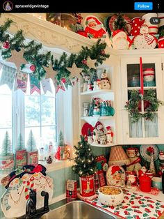 a kitchen decorated for christmas with lots of holiday decorations