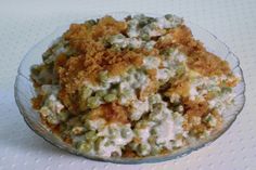 a bowl filled with food sitting on top of a white tablecloth covered table cloth