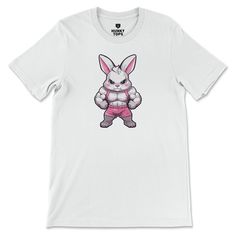 Hopping into a powerful workout has never been this fierce! Introducing our "Gym Bunny" T-Shirt, designed for those who match their strength and agility with a playful charm. Don this t-shirt and let your fitness journey be as vibrant and energetic as a lively bunny. Made from soft, breathable fabric, this t-shirt ensures your comfort while you're pumping iron or crushing that cardio. So, are you ready to transform into a gym bunny and start flexing those muscles with style? Athleisure Crew Neck Graphic Print Muscle Tee, Athleisure Muscle Tee With Graphic Print Crew Neck, Athleisure Graphic Print T-shirt For Training, Sporty Graphic Print Muscle Tee For Sports, White Letter Print T-shirt For Training, Graphic Print Crew Neck Activewear Tee, White Crew Neck Muscle Tee For Gym, Casual Graphic Print T-shirt For Gym, Sporty Graphic Print Muscle Tee For Workout