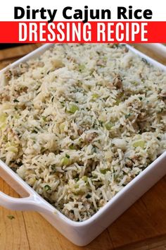 a white casserole dish filled with rice and vegetables on a wooden table in front of the words dirty cajun rice dressing recipe