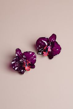 Based in: USAMake a statement with these handmade orchid earrings! Crafted with soy-based resin, they are stylish and fashion-forward. Exquisitely unique, these orchid earrings are sure to be admired and appreciated. Create a one-of-a-kind look that shows off your individual style! Details Made in: Broward, Florida Dimensions: 1.75" in. x 1.75" in. Metal: nickel-free earring back Material: soy-based resin Care: Keep away from moisture and harsh chemicals and allow perfumes and lotion to dry befo Orchid Earrings, 3d Technology, Pink Orchids, Nickel Free Earrings, Individual Style, Beauty Shop, Earring Backs, Cute Jewelry, Glass Blowing