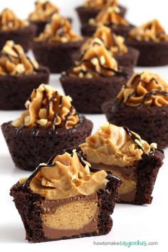 there are many cupcakes with chocolate frosting and nuts on top