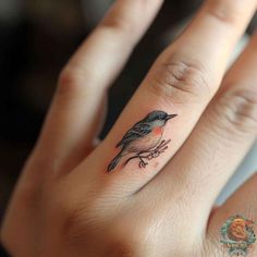 a small bird tattoo on the ring finger is an excellent idea for someone who wants to get inked