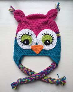 a crocheted owl hat with big eyes