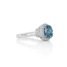 Indulge in the mesmerizing allure of this 4.16 Cts Blue Zircon and White Diamond Ring. Crafted in 14K white gold, this exquisite piece showcases a stunning blue zircon gemstone, radiating with brilliance and elegance. Adorned with shimmering white diamonds, this timeless design is a true symbol of sparkle and beauty. Blue Topaz Ring In 14k White Gold, Blue Topaz Ring Brilliant Cut For Promise, Blue Cubic Zirconia Diamond Ring With Center Stone, Blue Diamond Birthstone Ring With Accent Stones, Blue Cubic Zirconia Topaz Ring With Round Cut, Blue Topaz Cubic Zirconia Ring With Round Cut, Blue Sapphire Topaz Ring With Diamond Cut, Blue Topaz Ring With Diamond Accents And Cubic Zirconia, Blue Diamond Birthstone Ring With Brilliant Cut