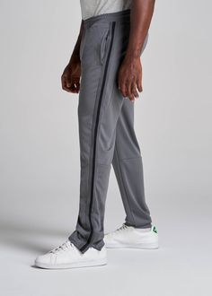 About Our Tall Men's Pants These men's tall athletic pants are a classic take on an athleisure essential. When it comes to athleisure, a good fit is key. You need something that's comfortable enough to relax in yet capable enough to work out in – but as a tall guy, it can be hard to find options that work for your height. You either have to compromise on a baggy fit or settle for lengths that are way too short. Not anymore. We know how hard it is to find quality styles when you're tall, which is Sportswear Sweatpants With Straight Hem, Straight Hem Sportswear Sweatpants, Sporty Sweatpants With Straight Hem For Sports, Straight Leg Sweatpants For Sports, Straight Leg Sweatpants With Comfort Waistband For Sports, Moisture-wicking Tapered Leg Joggers For Sports, Solid Color Sports Pants With Straight Hem, Sports Sweatpants With Elastic Side Panels And Straight Leg, Sports Straight Hem Solid Pants