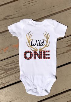 Wild one Birthday shirt,Wild One, deer antler birthday shirt, first birthday, rustic birthday, rustic party, rustic theme, 1st birthday, birthday shirt, birthday t Bodysuit is made with professional grade vinyl and heat pressed on to ensure that it wont come off after washing. Wild One Birthday Shirt, One Birthday Shirt, Rustic Birthday, Rustic Party, Wild One Birthday, First Birthday Shirts, Rustic Theme, Deer Antler, Wild One