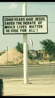 a street sign on the side of the road that says, 200 years ago jesus ended the time he died for all it