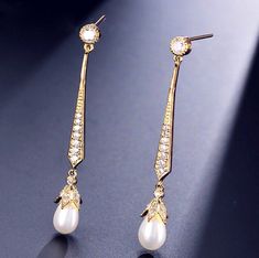 Delicate and shining brightly, this pair of earrings can complete the most sophisticated of looks. All it takes is a simple glance to see this extremely classy look that makes a glamorous and feminine statement. Adorned with iridescent teardrop pearls and flawless cubic zirconia that captures the light from every angle with a perfectly translucent appeal, the earrings are rhodium / rose gold / yellow gold plated for a flawless finish which perfectly enhances the intricate detailing and conveys a Cubic Zirconia Bridal Earrings, Bridal Earrings Pearl, Bridal Pearls, Art Deco Jewelry, How To Look Classy, Silver Rose Gold, Gold Yellow, Bridal Earrings, Gold Finish