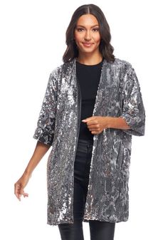 So much to love about the on-trend Sterling Sequin Kimono . . . Feather-weight and liquid, despite the fact that all-over sequins flip from Silver to Charcoal (party tricks, anyone?), we love the beautifully fluid and flowy feel. Steeped in Asian history dating to the eighth century, Kimono details remain unchanged. With a slightly dropped shoulder and oversize fit, we love how the satin-lined Sterling Sequin Kimono slips easily over all-Black separates for a quiet dinner. Over a favorite little Black dress, we'll wear it to the fanciest cocktail event. We love the wide, three-quarter length sleeves that mirror the loose-fitting 33" silhouette. Cheers for the convenient side seam pockets and velvet facings. Raise a glass to the Sterling Sequin Kimono and its cool elevated aesthetic. Glamorous Spring Sequin Fabric With Contrast Sequins, Glamorous Contrast Sequin Fabric For Spring, Glamorous Shimmer Sequin Fabric For Spring, Glamorous Sparkling Sequin Fabric For Spring, Sparkling Glamorous Sequin Fabric For Spring, Glamorous Winter Sequin Fabric For Night Out, Glamorous Sequin Fabric For Winter Night Out, Sparkling Sequin Fabric For Spring Night Out, Glamorous Winter Evening Sequin Fabric