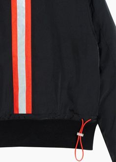 Experience comfort and style like never before with this Konus Men's Mock Collar Bomber Jacket! It's the perfect blend of practicality and fashion, featuring bellow pockets for convenient storage, an adjustable waist for a personalized fit, and reflective tape for enhanced visibility. Whether you're out running errands or on a night out, this jacket has got you covered. Trust us, you won't want to leave home without it! Slightly Oversized 100% polyester Imported Black Sporty Windbreaker With Side Pockets, Black Sporty Track Jacket With Side Pockets, Sporty Black Track Jacket With Side Pockets, Technical Long Sleeve Windbreaker With Pockets, Black Sports Outerwear With Side Pockets, Sporty Hooded Track Jacket For Work, Technical Outerwear With Ribbed Cuffs And Long Sleeves, Technical Long Sleeve Outerwear With Ribbed Cuffs, Black Half-zip Outerwear With Ribbed Cuffs