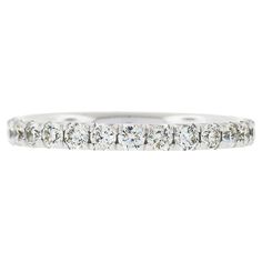 a white gold wedding band with five diamonds