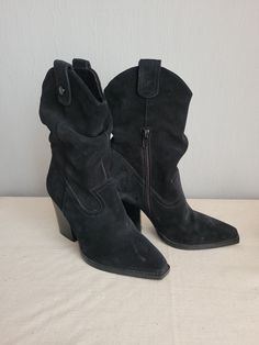 "Vintage black suede mid calf cowgirl boots with chunky heels for women.  Side half zippers, buckles on bootleg top. Subtle cowgirl/cowboy style. Fabric lining. Brand: Steve Madden (Made in Indonesia) Condition: used condition, great, without damages.  Sizes:  EU 37 (labeled), US 6.5 measurements: outsole length 26 cm / 10.1\" in heels height 9 cm/ 3.5\" in boots total height with heels 26 cm / 10.1\" in bottom sole width in widest place 9 cm / 3.5\" in" Western Wide Calf High Heeled Boots, Western Style High Heel Boots For Wide Calves, Western Style Heeled Boots With Wide Calf, Western Style Wide Calf Heeled Boots, Western Style Block Heel Heeled Boots For Winter, Western Block Heel Boots For Winter, Western Style High Heel Mid-calf Boots For Winter, Western Style High Ankle Suede Heeled Boots, Mid-calf Boots For Rodeo