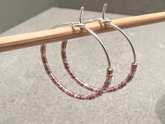 "Minimalist and dainty, these beaded hoop earrings go with everything! Alternating tiny Miyuki Delica seed beads in metallic shades of silver, pink (rose gold), and gold give these an elegant and classic look.  This pair of beaded hoops is made with genuine Japanese Miyuki Delica seamless glass cylinder seed beads.  The hoop size is 25 mm diameter (approximately 1 inch circle), and is made with hypoallergenic, nickel-free, and lead-free 22-gauge wire (0.7mm thick).  𝗦𝗘𝗖𝗢𝗡𝗗𝗔𝗥𝗬 𝗖𝗢𝗟𝗢𝗥 Silver Hoop Earrings With Tiny Beads, Silver Small Hoop Earrings With Tiny Beads, Small Silver Hoop Earrings With Tiny Beads, Everyday Beaded Silver Hoop Earrings, Everyday Silver Beaded Hoop Earrings, Silver Hoop Earrings With Tiny Beads As A Gift, Handmade Pink Minimalist Hoop Earrings, Minimalist Handmade Pink Hoop Earrings, Rose Gold And Gold