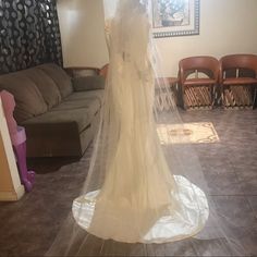 a wedding dress on display in a living room