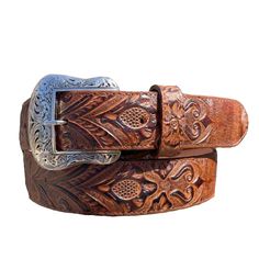 These hand tooled print cowgirl belts feature intricate designs and provide a unique touch to any outfit. Made with high-quality leather, these belts are durable and fashionable. Genuine leather 1.5" Wide Texas buckle Made in Mexico Brown Hand Tooled Bohemian Belts, Luxury Vintage Hand Tooled Belts, Luxury Western Brown Belt Buckles, Tooled Belts, Traditional Hand Tooled Brown Belt, Cowgirl Boots Square Toed, Cowgirl Belts, Southwestern Hand-tooled Brown Belt Buckles, Python Print