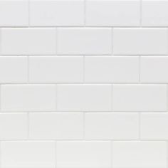 a white tiled wall with no one in it