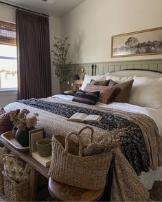 a large bed sitting next to a window in a bedroom