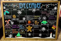 a chalk board with christmas decorations on it