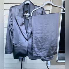 This Is Brand New With Tags And I Have The Matching Blazer For Sale In My Posh Closet Too! This Is Beautifully Made And Great Quality. This Color Is Pewter But Has A Satiny Finish. The Cover Photo Is An Accurate Color In Natural Light. This Is Brand New With Tags And Never Worn, But There Is A Very Small Stain On The Back Left Seat Area. See Photos. Fully Washable. I Was Going To Spot Clean It But Didn’t Want To Mess Anything Up. It’s Definitely Washable. Super High Waisted. Wide Leg. Front Pockets. Has Pockets! 100% Polyester. Machine Washable. Recommended Hang To Dry. Zipper And Hook N Eye Closure. Waist: 28” Inseam: 32” Rise: 12” Original Retailed For $98! 2+ Items Bundle Gray Wide Leg Formal Bottoms, Elegant Gray Wide-leg Dress Pants, Gray Non-stretch Wide Leg Pants, Gray Wide-leg Dress Pants With Belt Loops, Silver Stretch Wide-leg Pants, Cover Photo, Wide Leg Trousers, Cover Photos, Natural Light