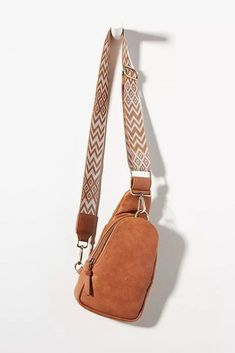 Sling Bag with Printed Strap-Brown – Jolie Vaughan Mature Women's Online Clothing Boutique Brown On-the-go Bag With Adjustable Straps, Trendy Chest Bag With Adjustable Strap For On-the-go, Trendy Brown Chest Bag For School, Trendy Brown Chest Bag For Travel, Trendy Brown Travel Chest Bag, Trendy Brown Bag With Adjustable Strap, Trendy Brown Leather Bag Strap, Trendy Leather Bags With Adjustable Straps, Casual Long Strap Crossbody Bag Strap