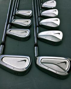 several different types of golf clubs lined up together