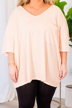 Get ready to look effortlessly chic with this adorable top! It features a casual, yet stylish cut for ultimate comfort! Pair it with your favorite leggings or skinny jeans for a stunning, coordinated look! The gorgeous cream peach makes it perfect for a daytime outing or a night out on the town! 100% Cotton Trendy Heather Peach Crew Neck Top, Trendy Apricot Tops For Spring, Spring Apricot Trendy Tops, Feminine Oversized Top For Day Out, Oversized Feminine Top For Day Out, Trendy Stretch Peach Top, Chic Peach Top For Fall, Chic Apricot Short Sleeve Tops, Trendy Peach Tops With Relaxed Fit